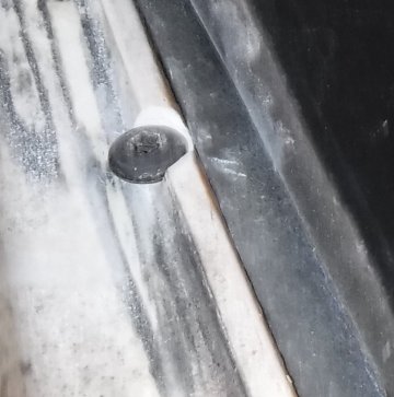 1992 Ford Bronco - One of the two bolts I added for the front feet, looking up at the ridge behind the topper's weatherstrip. I had to carve out a bit of the…