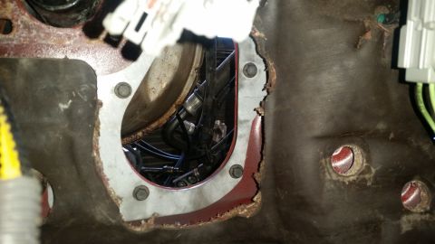 1985 Ford Bronco - Engine bay component with visible wiring and metal housing, likely part of a transmission or engine assembly.