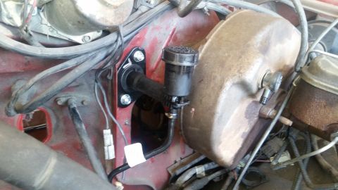1985 Ford Bronco - Close-up view of the clutch master cylinder and brake booster assembly, likely part of a ZF swap.