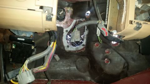 1985 Ford Bronco - Close-up of the dashboard and firewall area, showing exposed wiring and components.