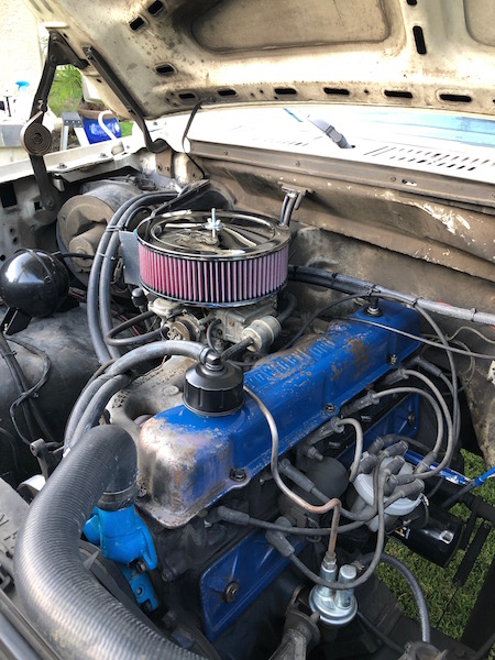 1981 Ford Bronco - Close-up view of the engine bay, blue valve covers and a prominent red air filter assembly.