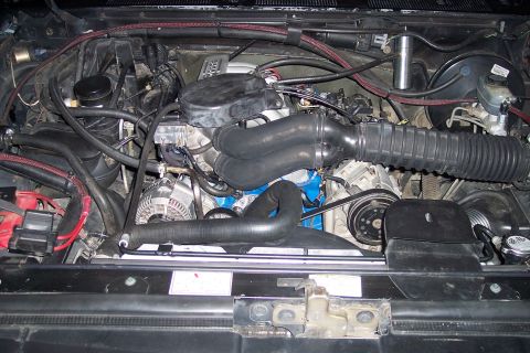 1995 Ford Bronco - The engine bay of a 1992 Ford Bronco is shown, with various components and wiring visible.