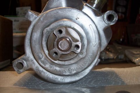 1995 Ford Bronco - This image shows a close-up view of a power steering pump, a critical component for vehicle operation.
