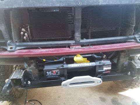 1995 Ford Bronco - The front of a 1995 Ford Bronco shows a newly installed Smittybilt winch.