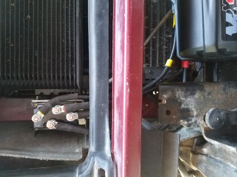1995 Ford Bronco - Close-up view of winch wiring and radiator components, with visible text from Supermotors.net.