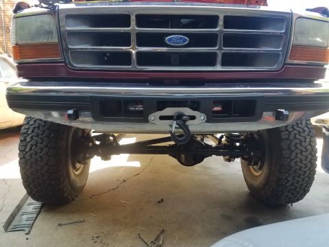 1995 Ford Bronco - Front view of a Ford Bronco showing a newly installed winch on the bumper.