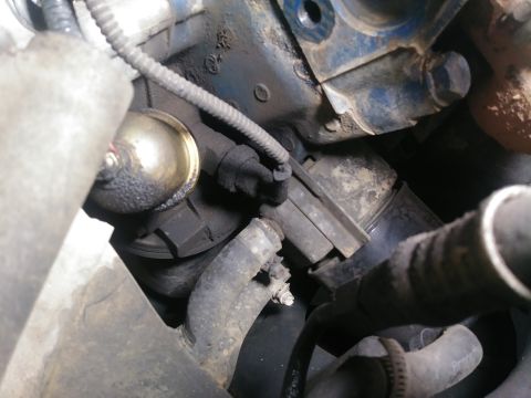 1996 Ford Bronco - Engine bay detail showing a sensor and associated plumbing, likely part of a fluid system.