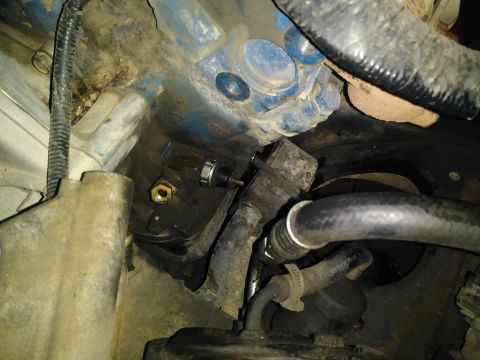 1996 Ford Bronco - This is a close-up view of an engine oil pressure sensor and associated plumbing.