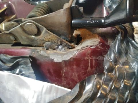 1996 Ford Bronco - Detail of a corroded door handle assembly, showing mechanical components and a part number.