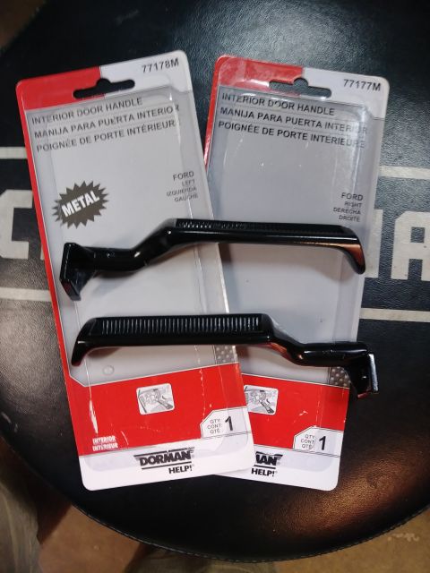 1996 Ford Bronco - Two Dorman interior door handles, labeled for Ford vehicles, are displayed.