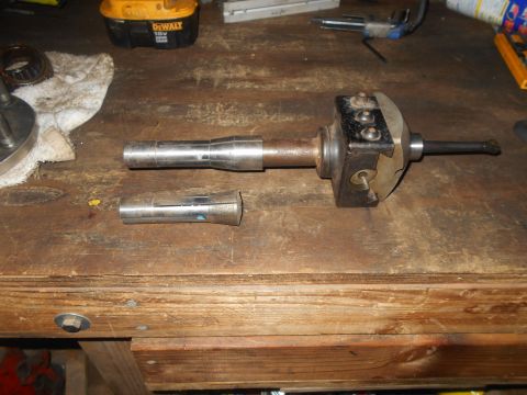 1992 Ford Bronco - A workbench with various metal tools and a DeWalt battery pack.