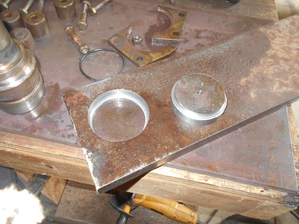 Metalworking scene with rusted metal, circular cutouts, bolts, and nuts.