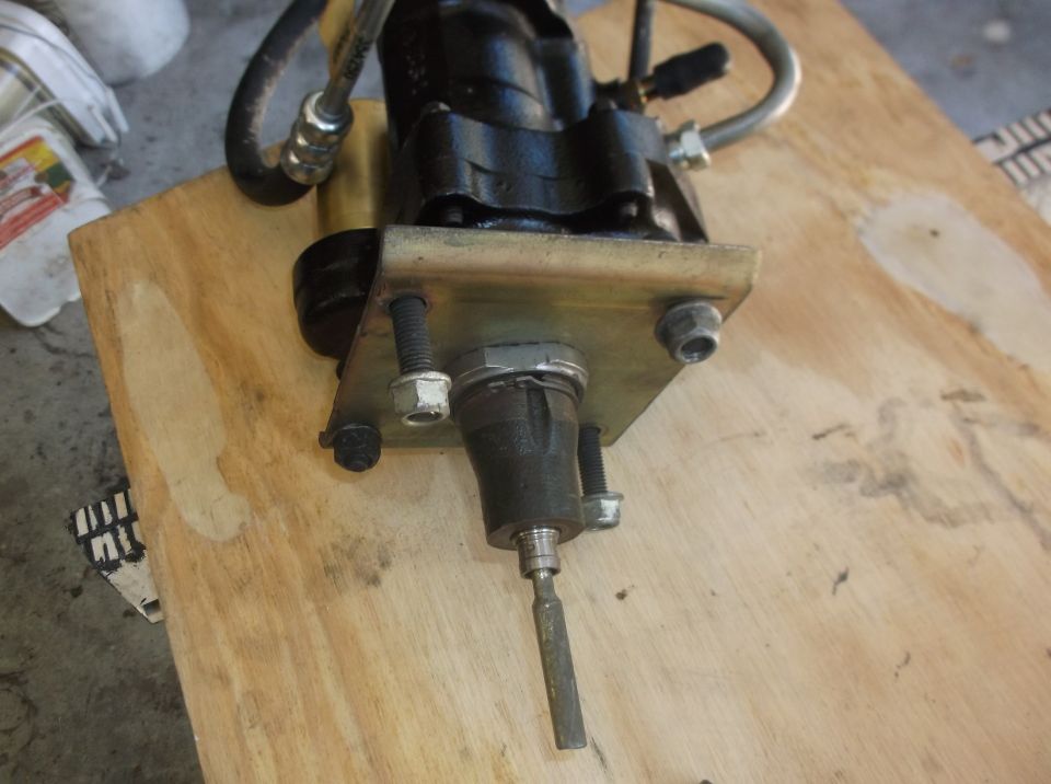 Black clutch master cylinder assembly on plywood