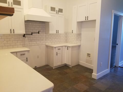 1994 Ford Bronco - Photograph of a remodeled white kitchen, not a technical document.