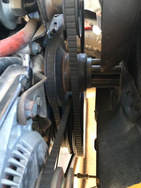 1979 Ford Bronco - This close-up engine bay view shows a V-belt system with multiple pulleys and belts, likely part of the accessory drive for a 1979 Ford Bro…