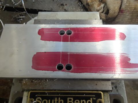 1985 Ford Bronco - Aluminum part being machined, showing layout fluid and drilled holes.
