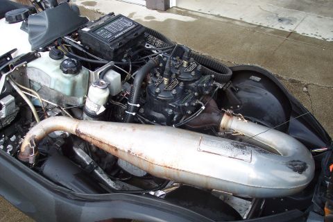 2004 Arctic Cat King Cat 900 - Close-up view of a snowmobile's engine compartment, showing various mechanical components.