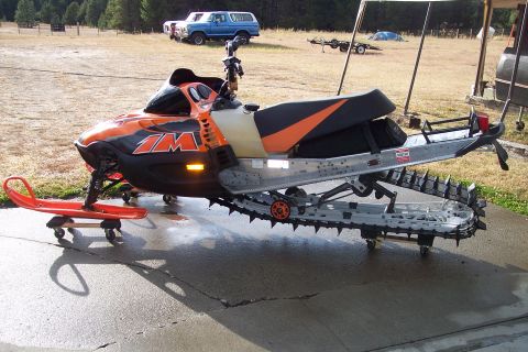 2004 Arctic Cat King Cat 900 - Snowmobile on a dolly with a red ski in front.