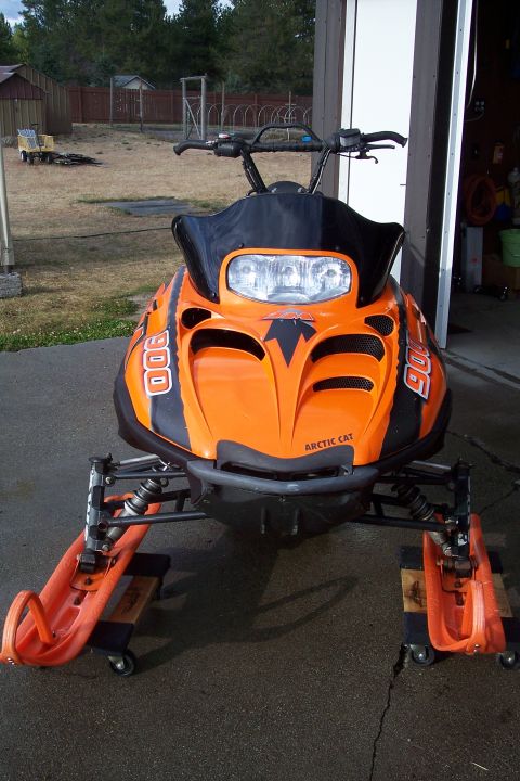 2004 Arctic Cat King Cat 900 - Front view of an orange and black Arctic Cat snowmobile, identified as a 2004 King Cat 900.