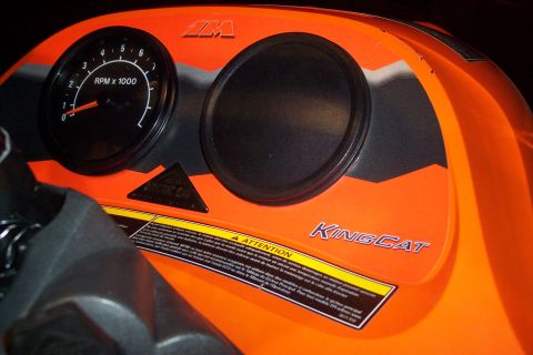 2004 Arctic Cat King Cat 900 - Close-up of a snowmobile's instrument panel, a tachometer and 'KINGCAT' branding.
