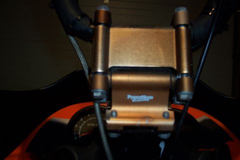 2004 Arctic Cat King Cat 900 - Close-up of a snowmobile's interior, showing the handlebars and dashboard area.
