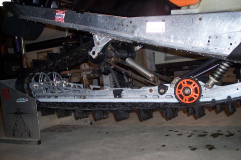 2004 Arctic Cat King Cat 900 - Close-up view of a snowmobile's track and suspension system components.