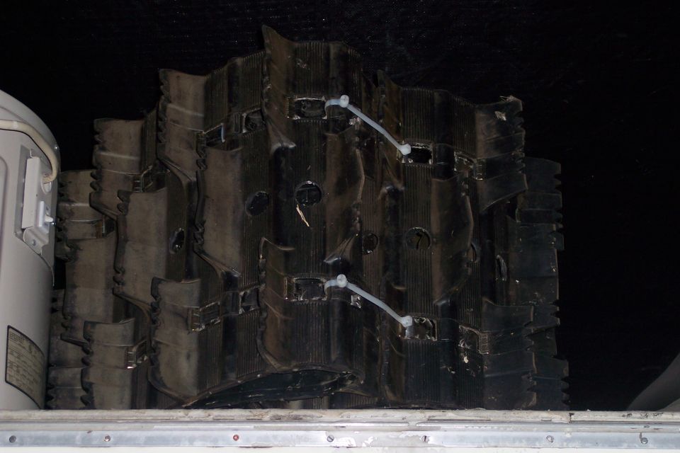 Stacked snowmobile tracks inside a vehicle
