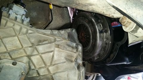 1985 Ford Bronco - Close-up view of a vehicle's transmission and clutch assembly, showing mechanical components.