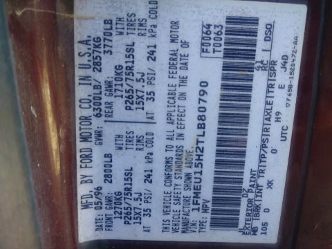 1996 Ford Bronco - Ford Motor Co. door certification label with weight ratings, tire/rim specs, VIN and exterior paint and trim codes.