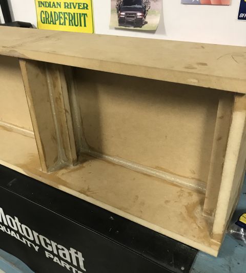 2014 Dodge 1500 - Custom wooden enclosure construction in progress, with visible bracing and adhesive.