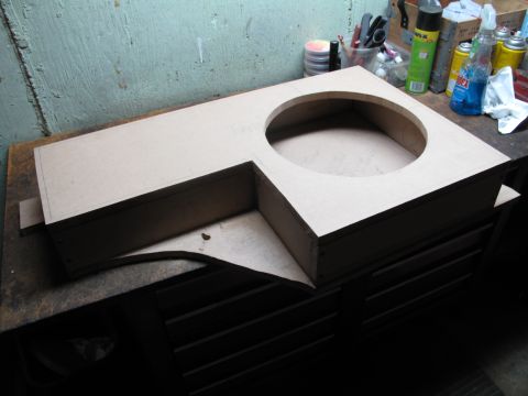 1994 Ford Bronco - A custom-built subwoofer enclosure is shown on a workbench, ready for installation.