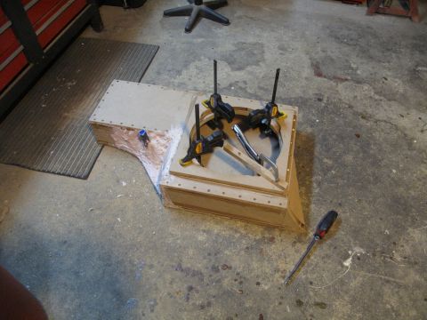 1994 Ford Bronco - A custom subwoofer enclosure is under construction, held together with clamps and screws.