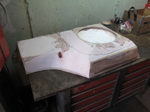 1994 Ford Bronco - A mold for a car part sits on a workbench, ready for casting.