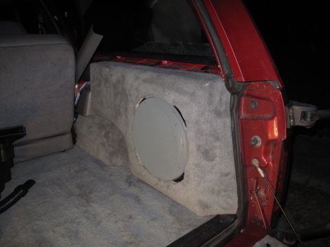 1994 Ford Bronco - Custom carpeted subwoofer enclosure installed in the cargo area of a 1994 Ford Bronco.