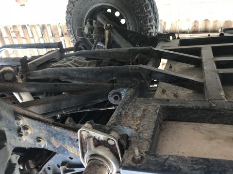 1970 Volkswagen Beetle - Close-up view of the undercarriage and suspension system of a vehicle.