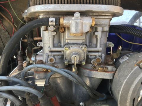 1970 Volkswagen Beetle - A detailed view of a vehicle's engine carburetor and associated wiring.