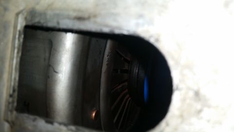 1985 Ford Bronco - A close-up view inside a metal housing shows a fan or impeller with blue accents. The housing appears to be part of a mechanical component,…
