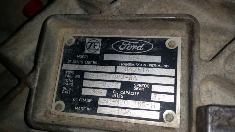 1985 Ford Bronco - Close-up of a ZF/Ford automatic transmission data plate showing model, serial number, gear ratio, build date and oil specifications.
