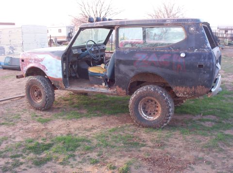1988 Ford Bronco - This heavily modified International Harvester Scout II is in poor condition, with missing body panels and visible rust.