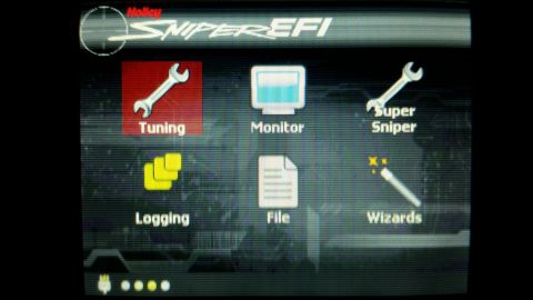 1985 Ford Bronco - This is a screenshot of a digital display showing a menu with icons and text for a Holley Sniper EFI system. The menu options include Tunin…
