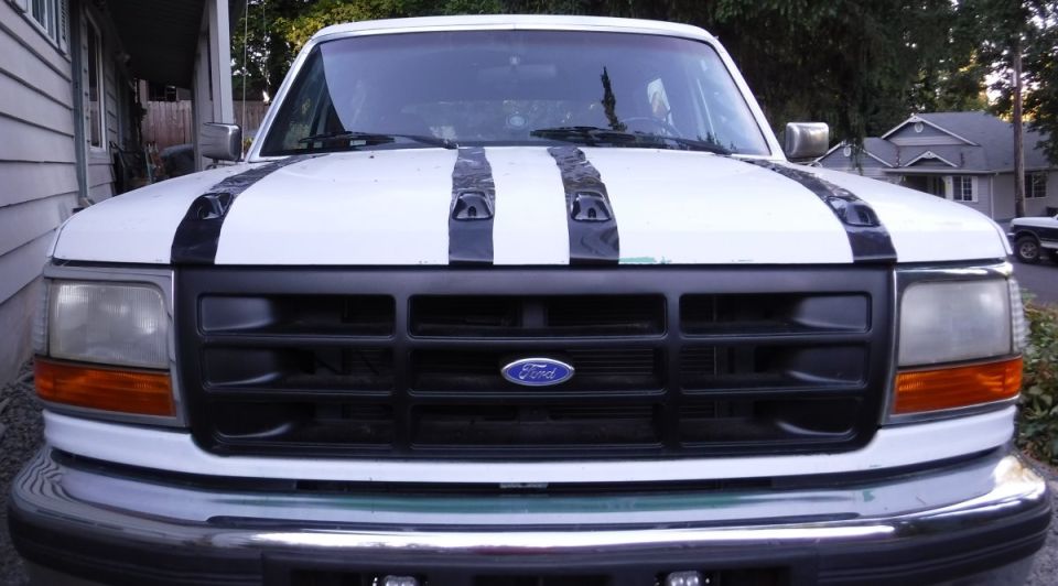 Hood marker lights with temporary racing stripes.