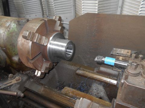 1992 Ford Bronco - A metal workpiece is being machined on a lathe. The workpiece is held in a chuck on the headstock of the lathe, and a cutting tool is mount…
