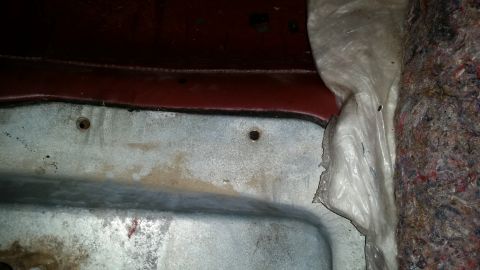 1985 Ford Bronco - Interior paneling and insulation are visible in this close-up shot.
