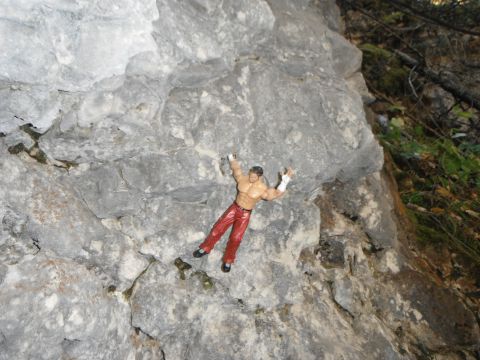 1987 Honda XL600R - Toy figure appears to be rock climbing on a large stone formation.