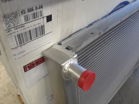 1985 Ford Bronco - A new aluminum radiator is shown, packaged for shipping.