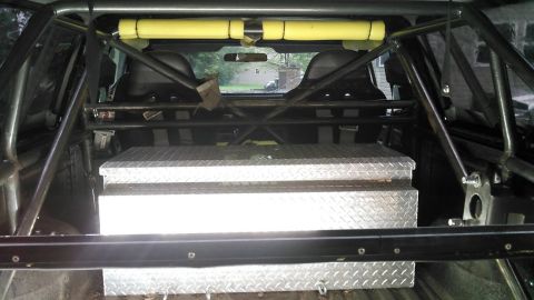 1978 Ford Bronco - Interior view of a vehicle equipped with a roll cage and a large toolbox.
