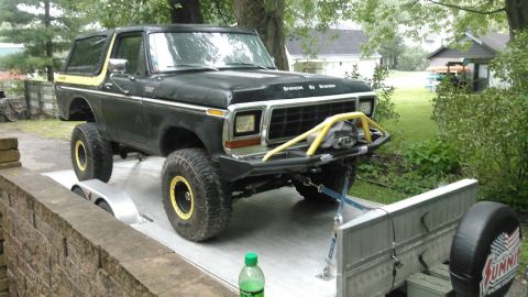 1978 Ford Bronco - A modified 1978 Ford Bronco is loaded onto a trailer, ready for transport.