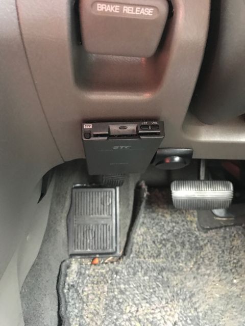 2002 Nissan Quest - Dashboard interior showing an ETC device and brake release lever.