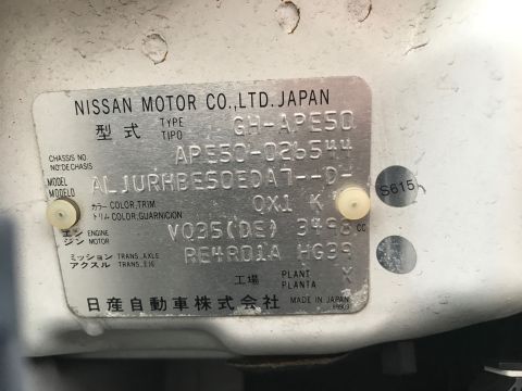 2002 Nissan Quest - Close-up of a vehicle's VIN plate, showing manufacturer details and model identification numbers.