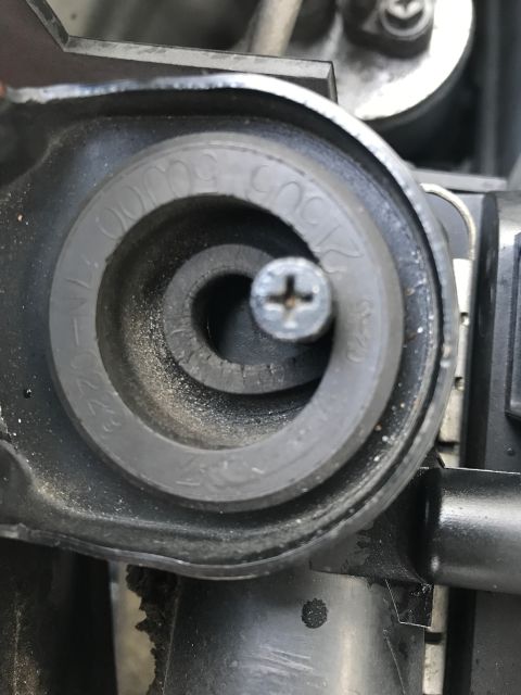 2002 Nissan Quest - A close-up view of a mechanical component with visible text and a screw fastener.